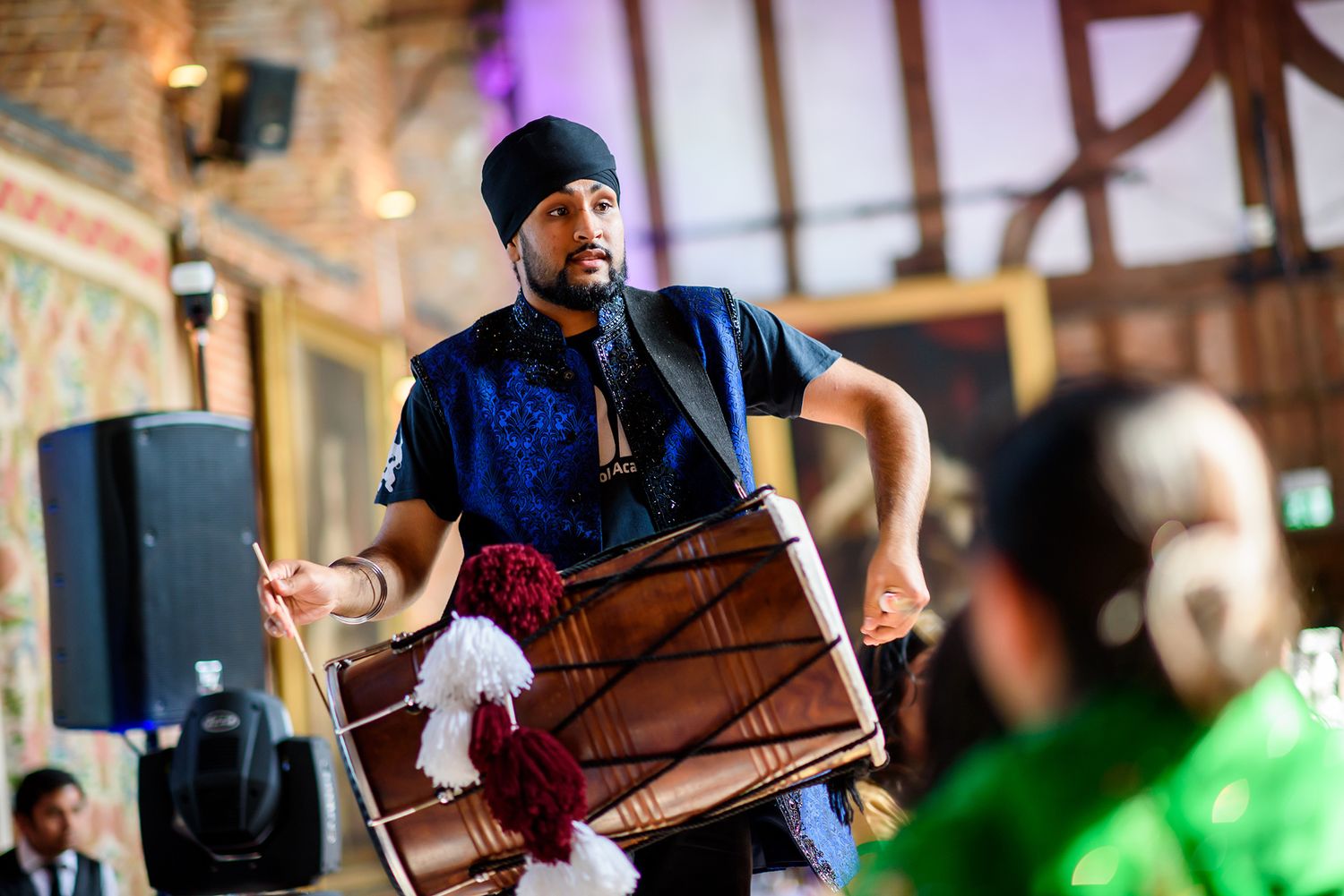 Musicians perform traditional music at an elegant wedding reception.