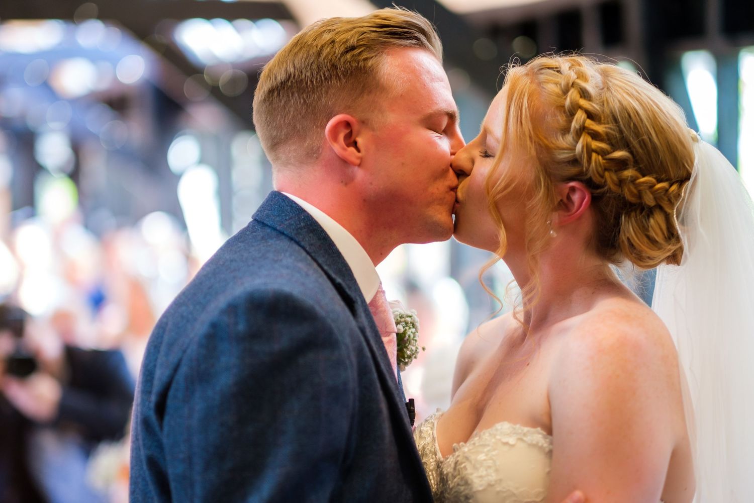 Romantic wedding couple sharing intimate moments during outdoor celebration.
