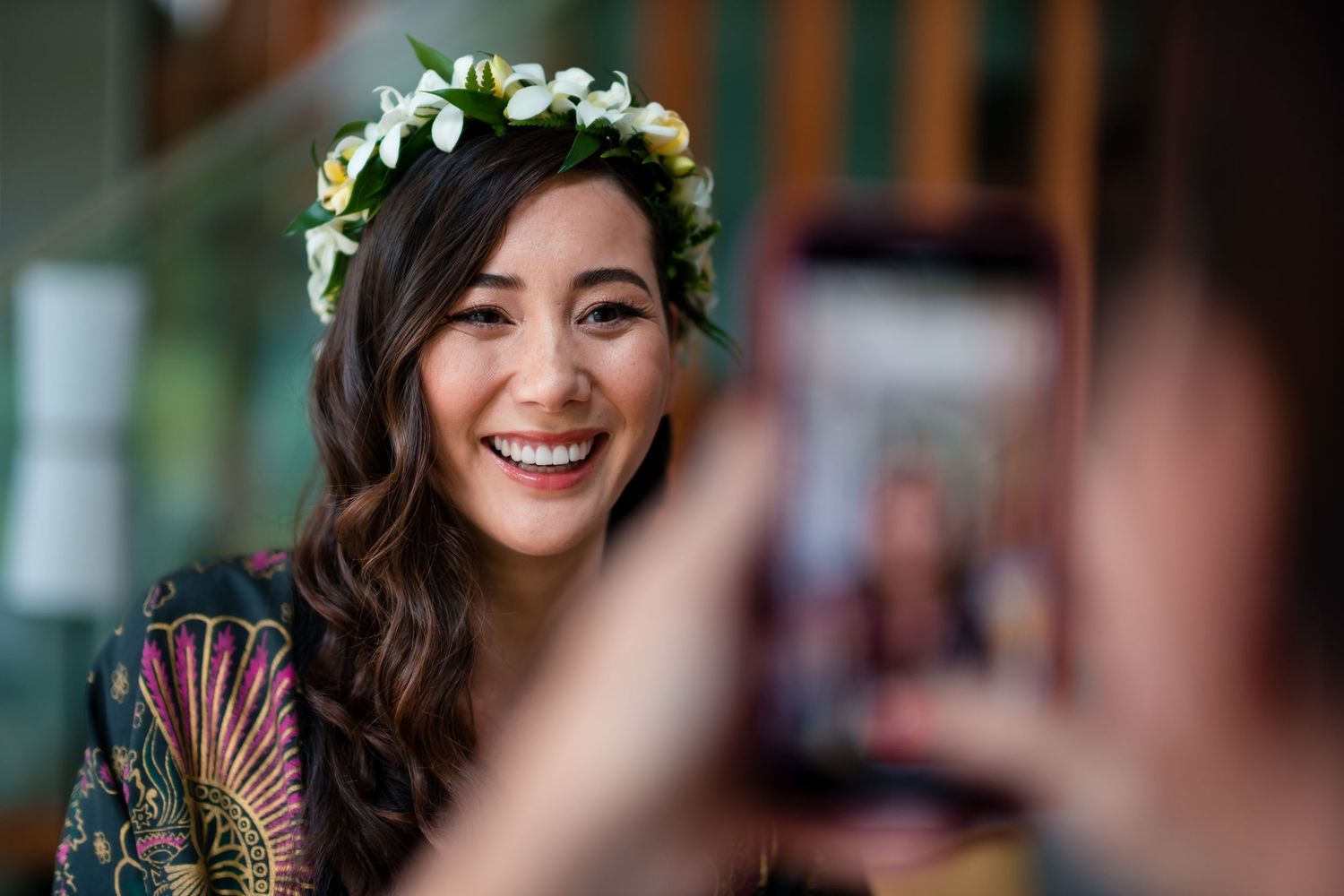 Wedding celebration with floral decorations in an elegant indoor setting.