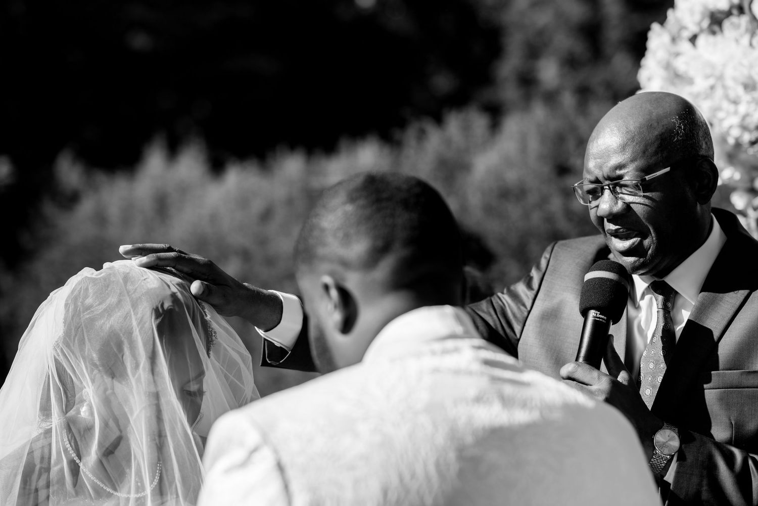 Black and white close-up shots of emotional moments during wedding ceremony.