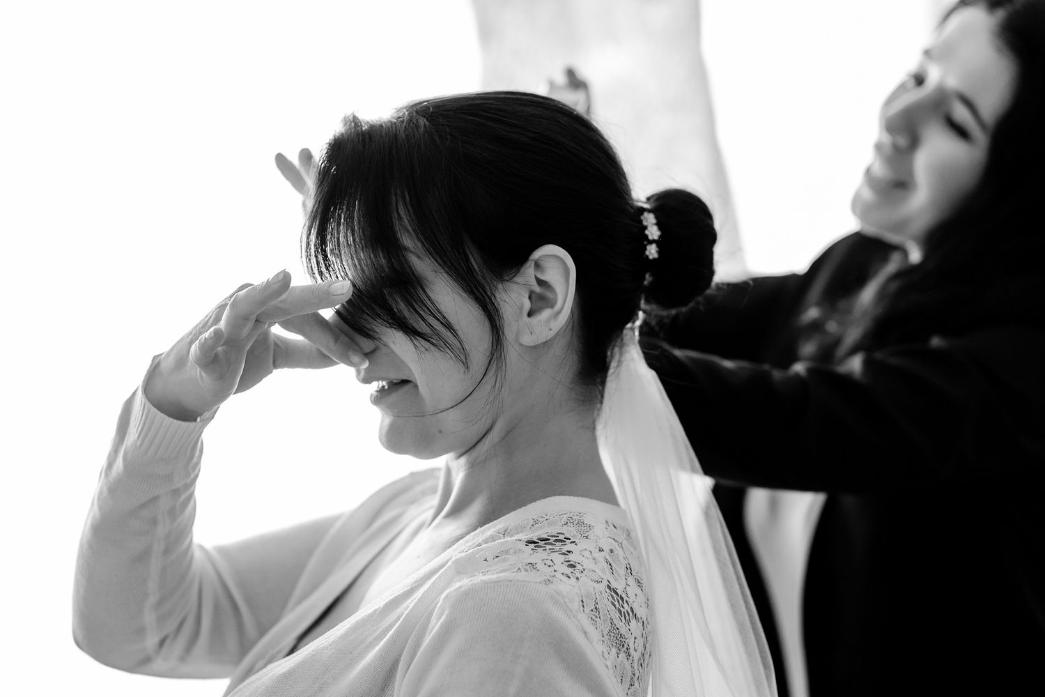 Side profile silhouettes of people getting ready in dramatic lighting.