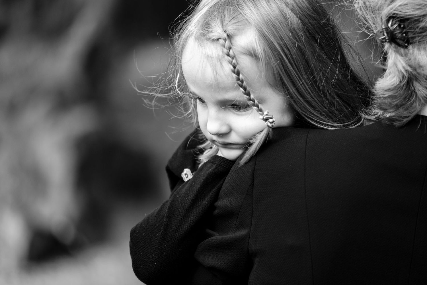 Artistic black and white wedding photography with natural light and shadows.