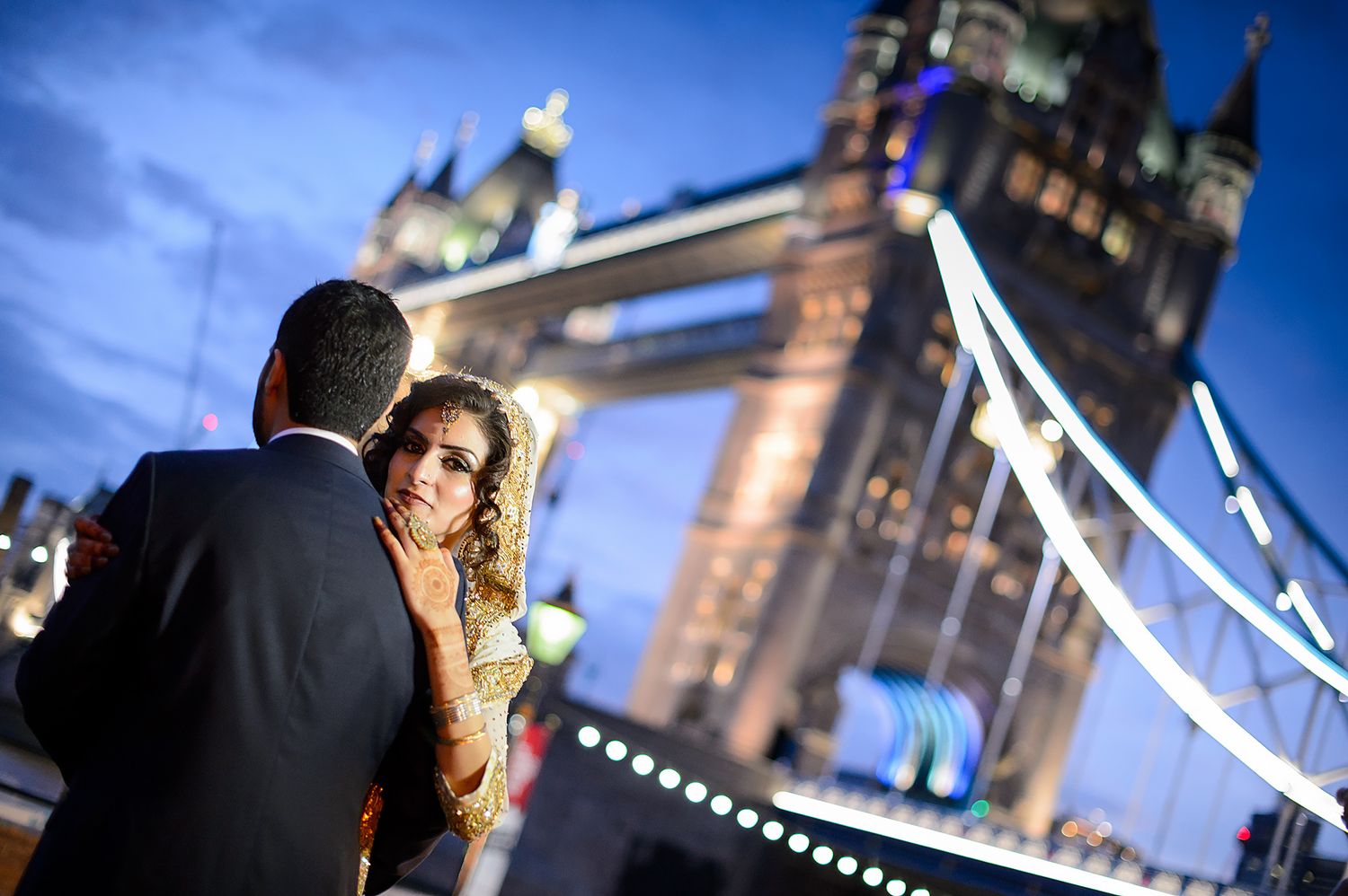 Tower Bridge evening photography session with city lights glowing in the background.