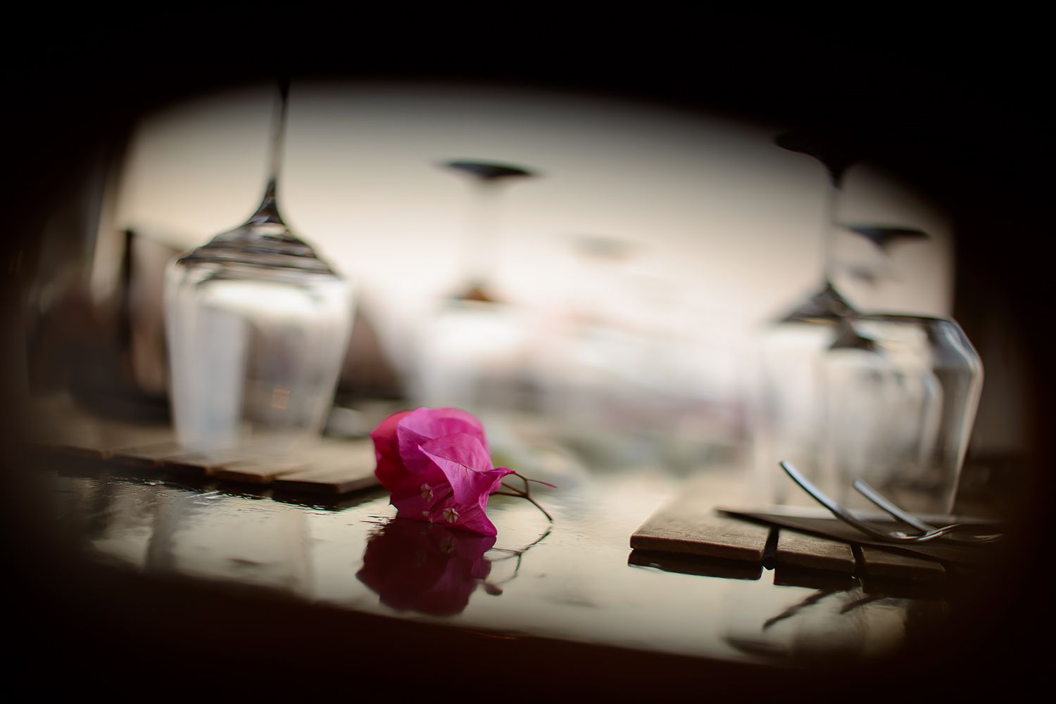Artistic vignette photo of wedding details in dramatic lighting.