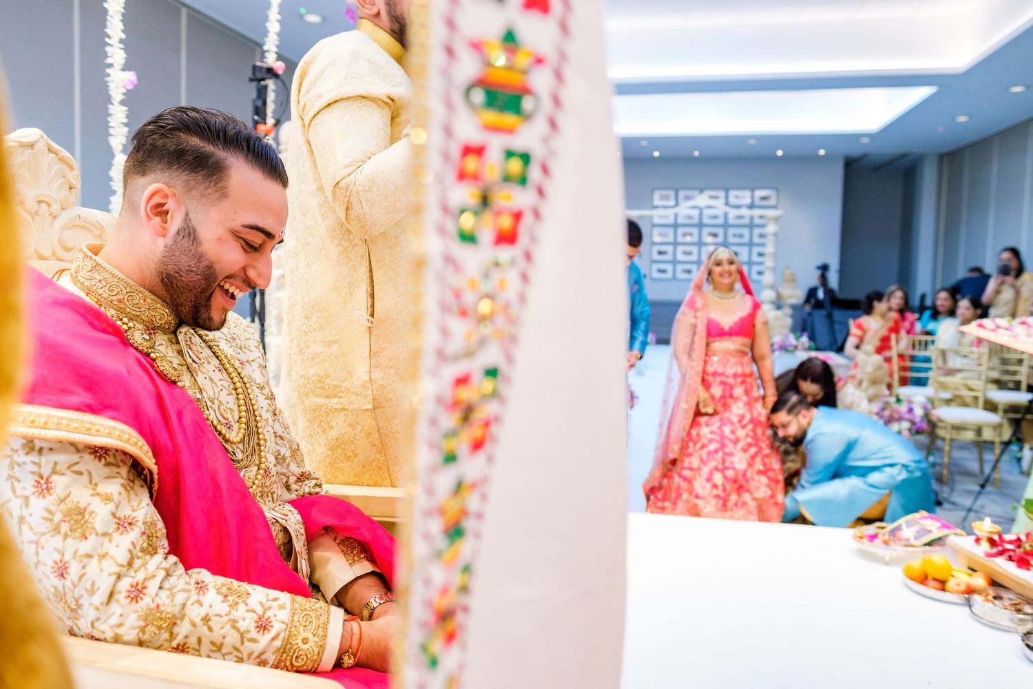 Vibrant Indian wedding ceremony decorations with colorful floral arrangements and traditional elements.