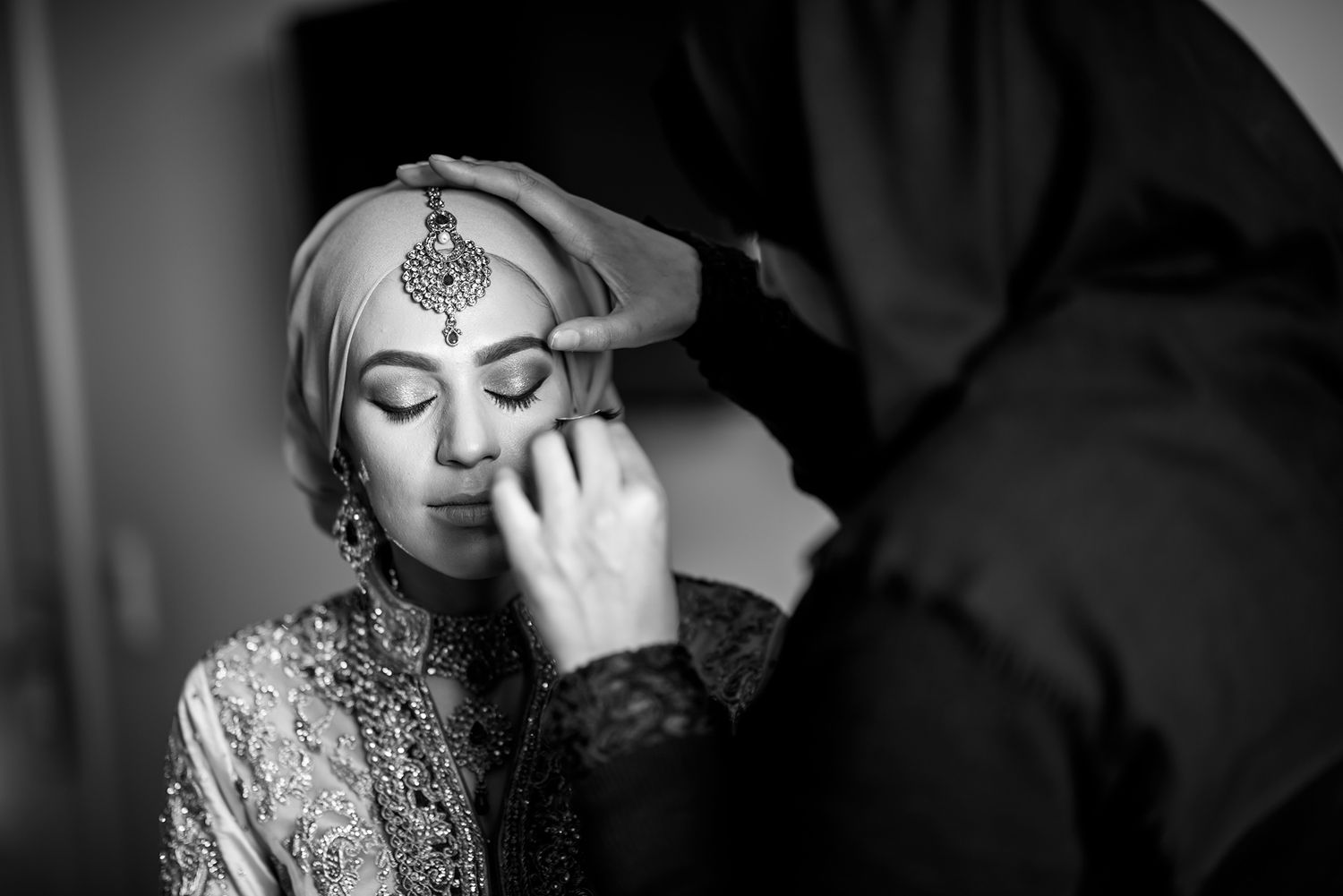 Artistic black and white close-up shots of wedding day preparations.