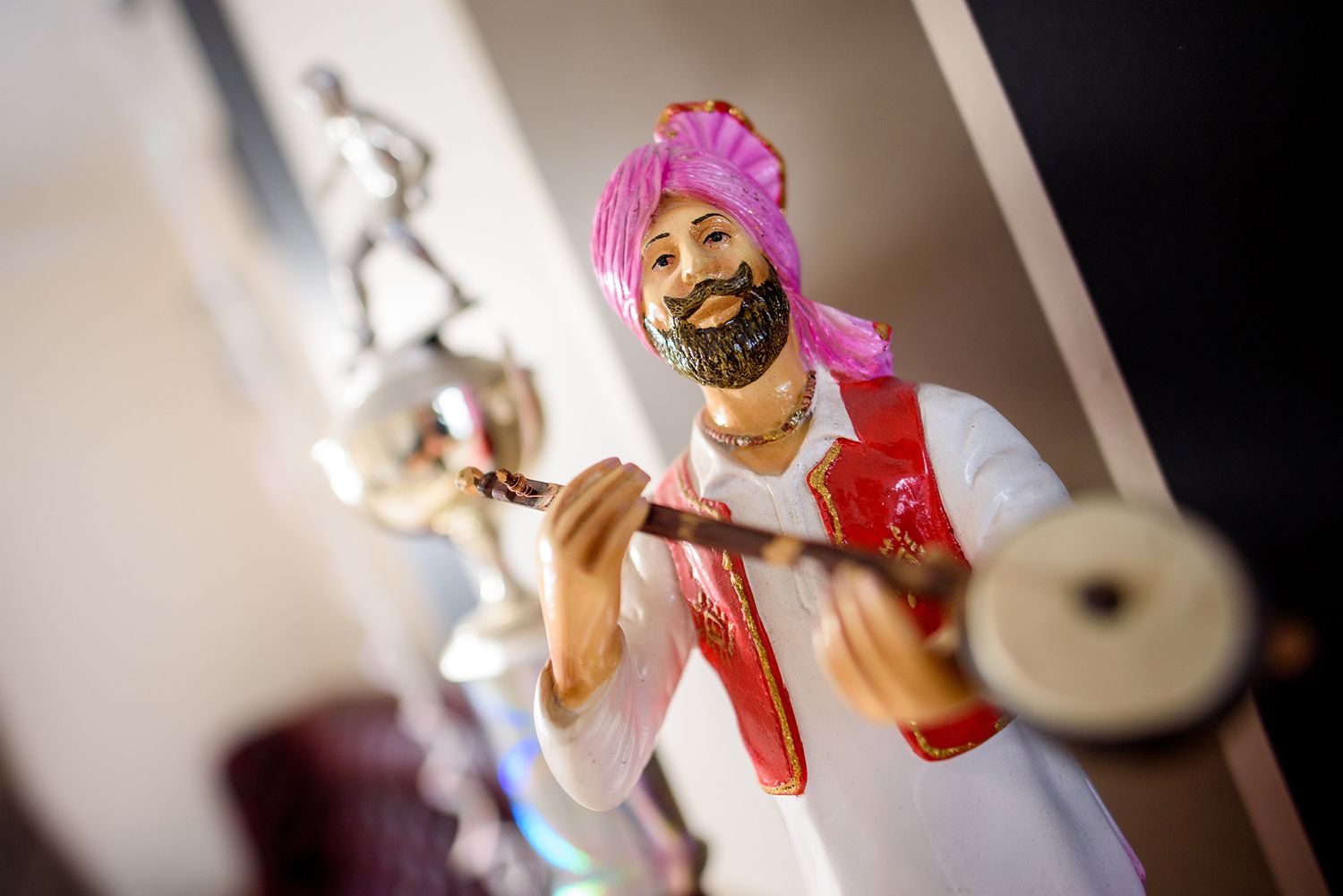 Close-up of traditional Indian musical instruments being played during a celebration.