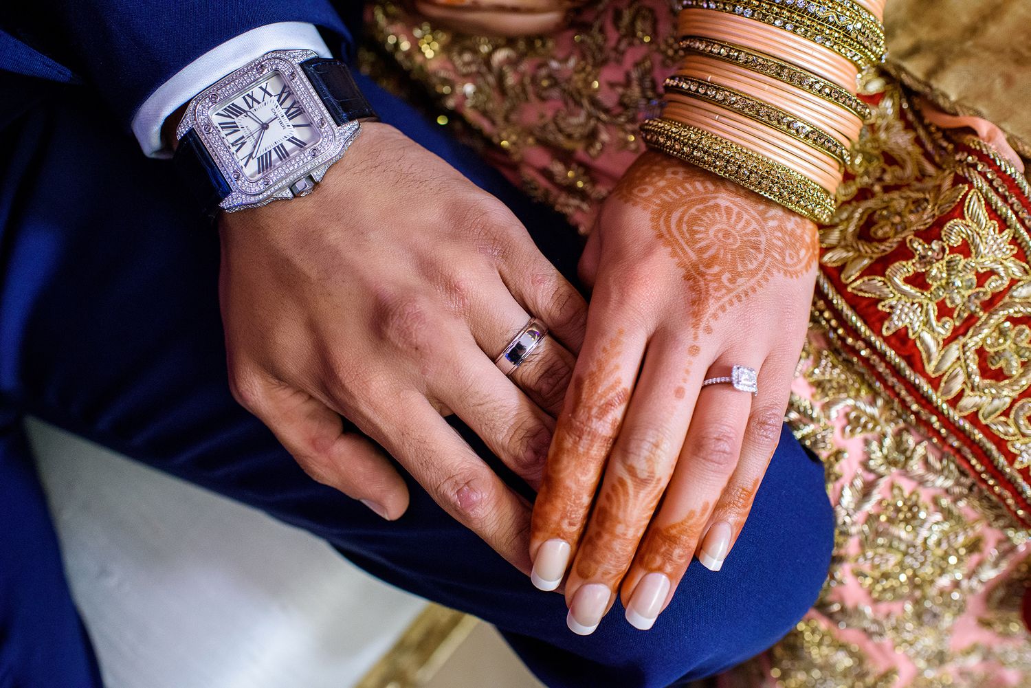 Wedding rings and traditional bangles showing fusion of Indian and Western wedding customs.