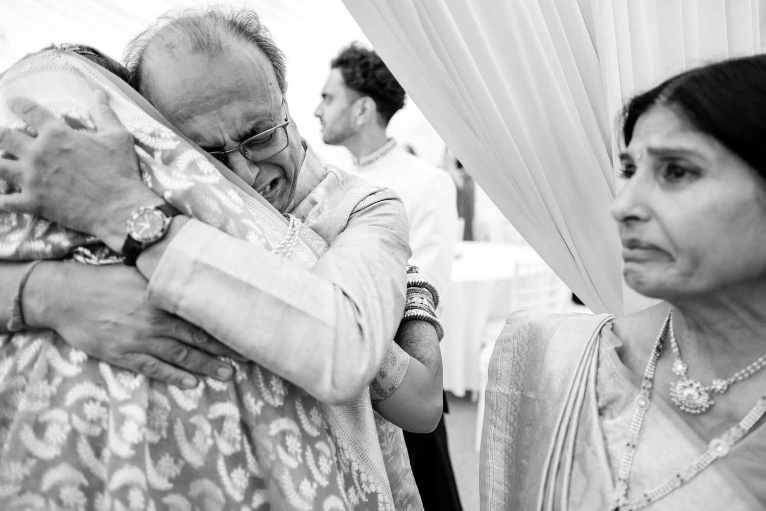 Traditional Indian wedding ceremony with guests participating in cultural rituals and blessings.