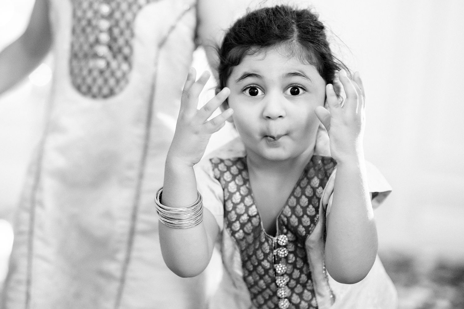 Playful black and white portrait series showing joyful expressions.