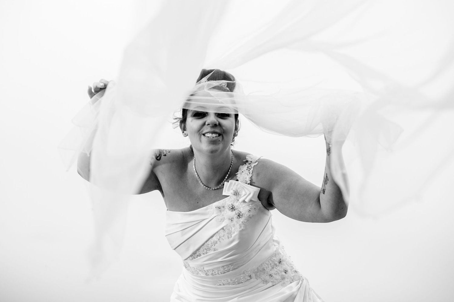 Happy moments captured in black and white during an outdoor wedding celebration.