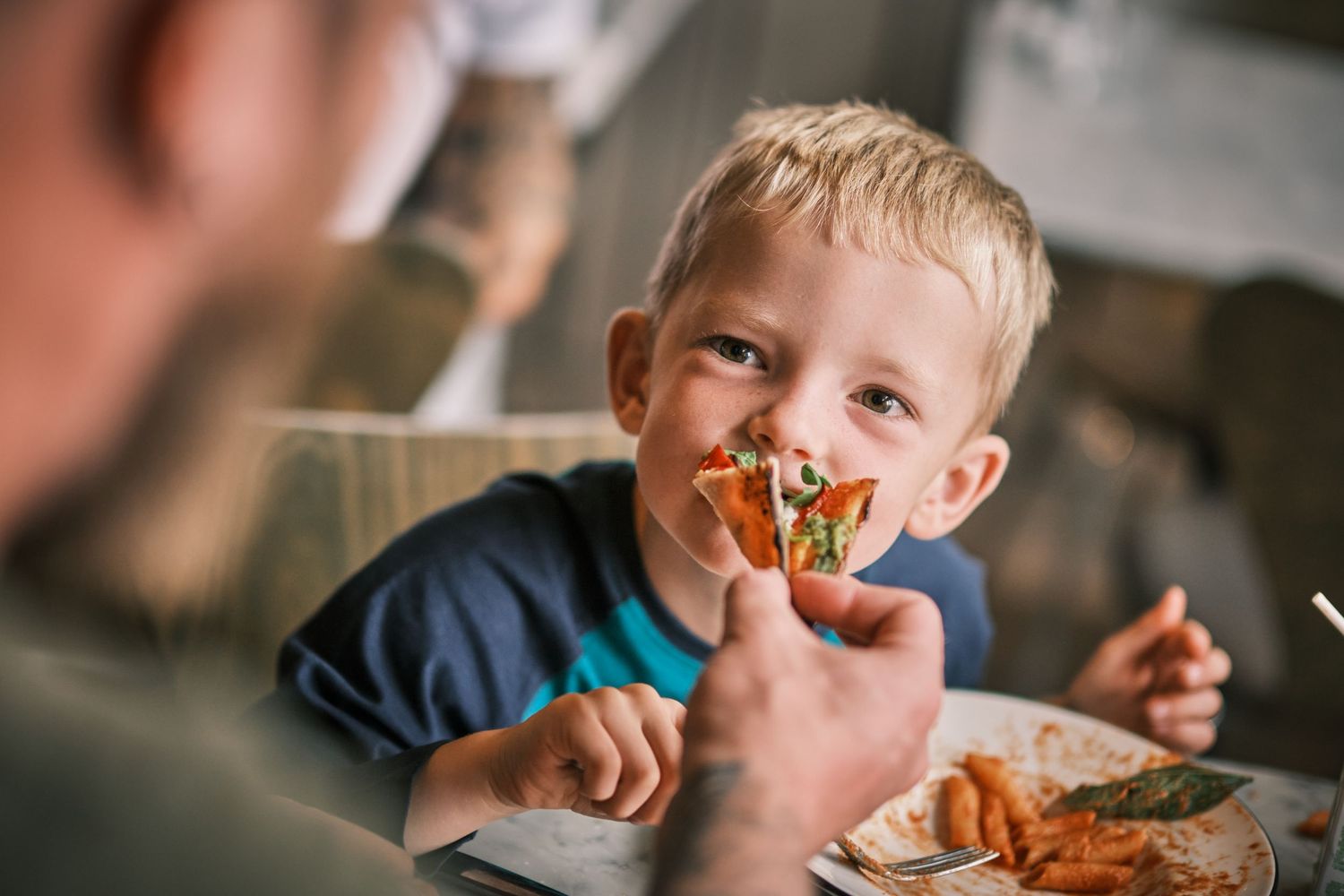 Pizza and Italian food being enjoyed at casual family restaurant.