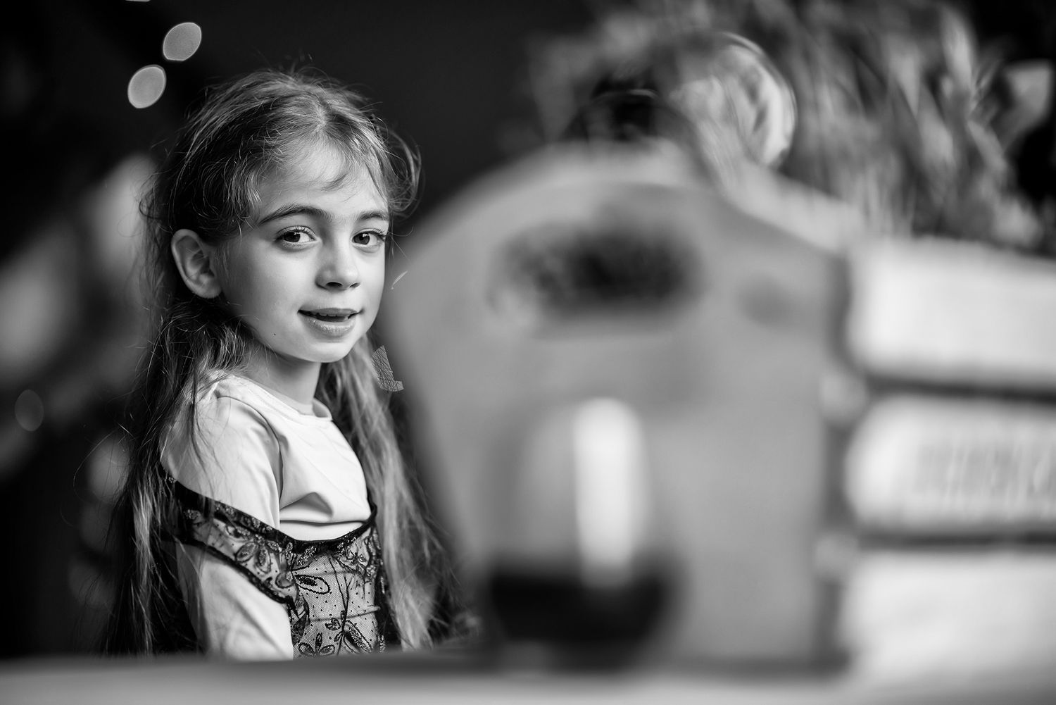 Black and white candid shots from a wedding celebration show joyful expressions.