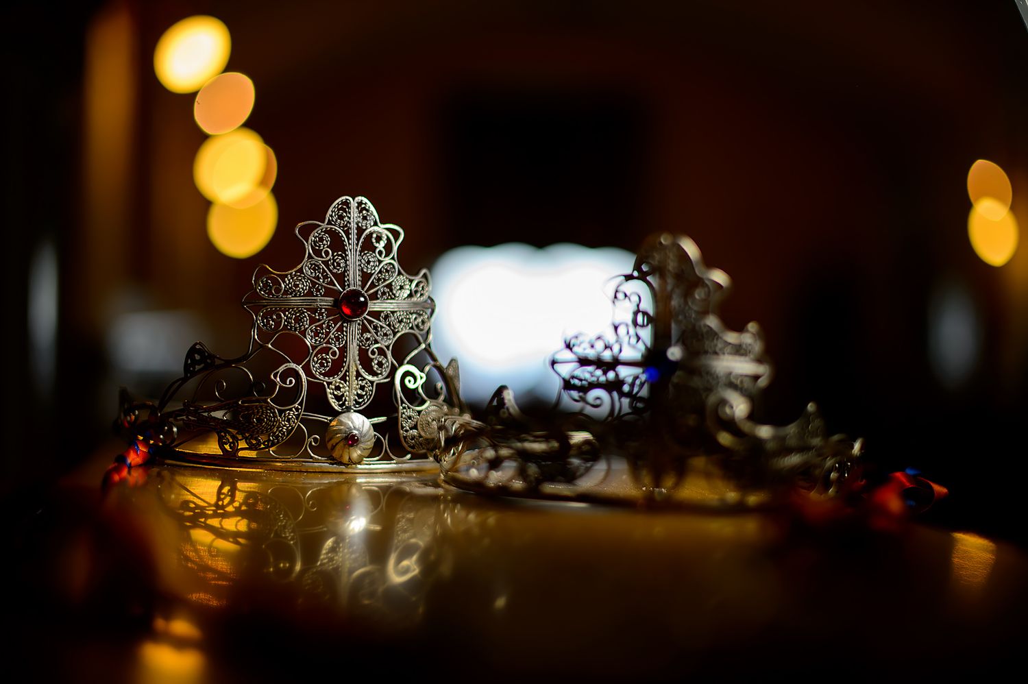 Wedding crown and accessories lit by warm ambient lighting.