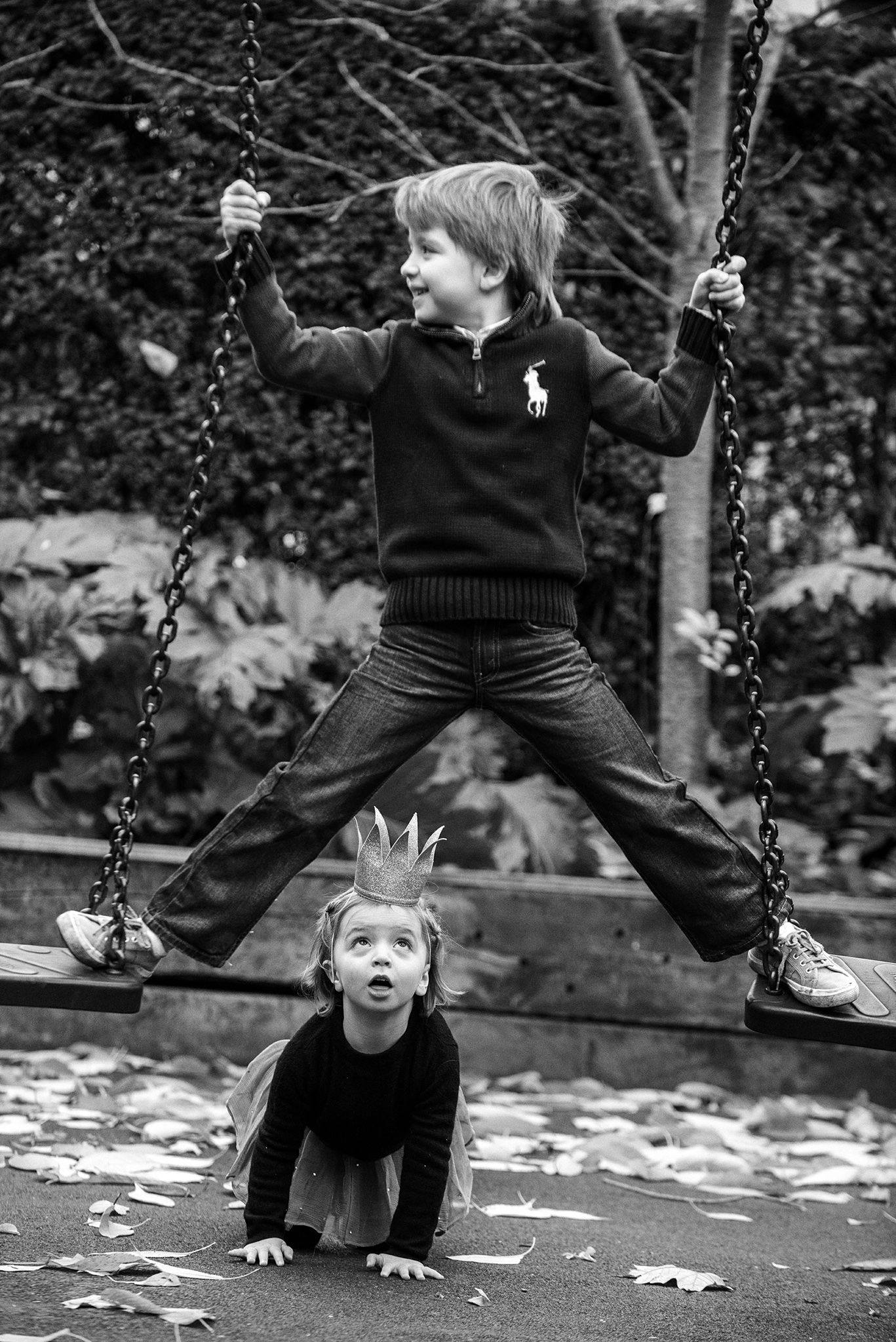 Sequential black and white photos capturing playful moments of children on swings in a park.