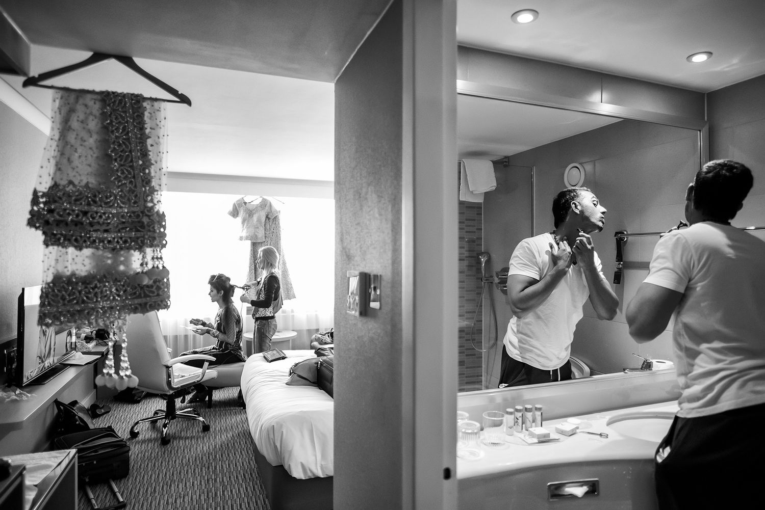 Monochrome images of wedding day preparations in various indoor settings.
