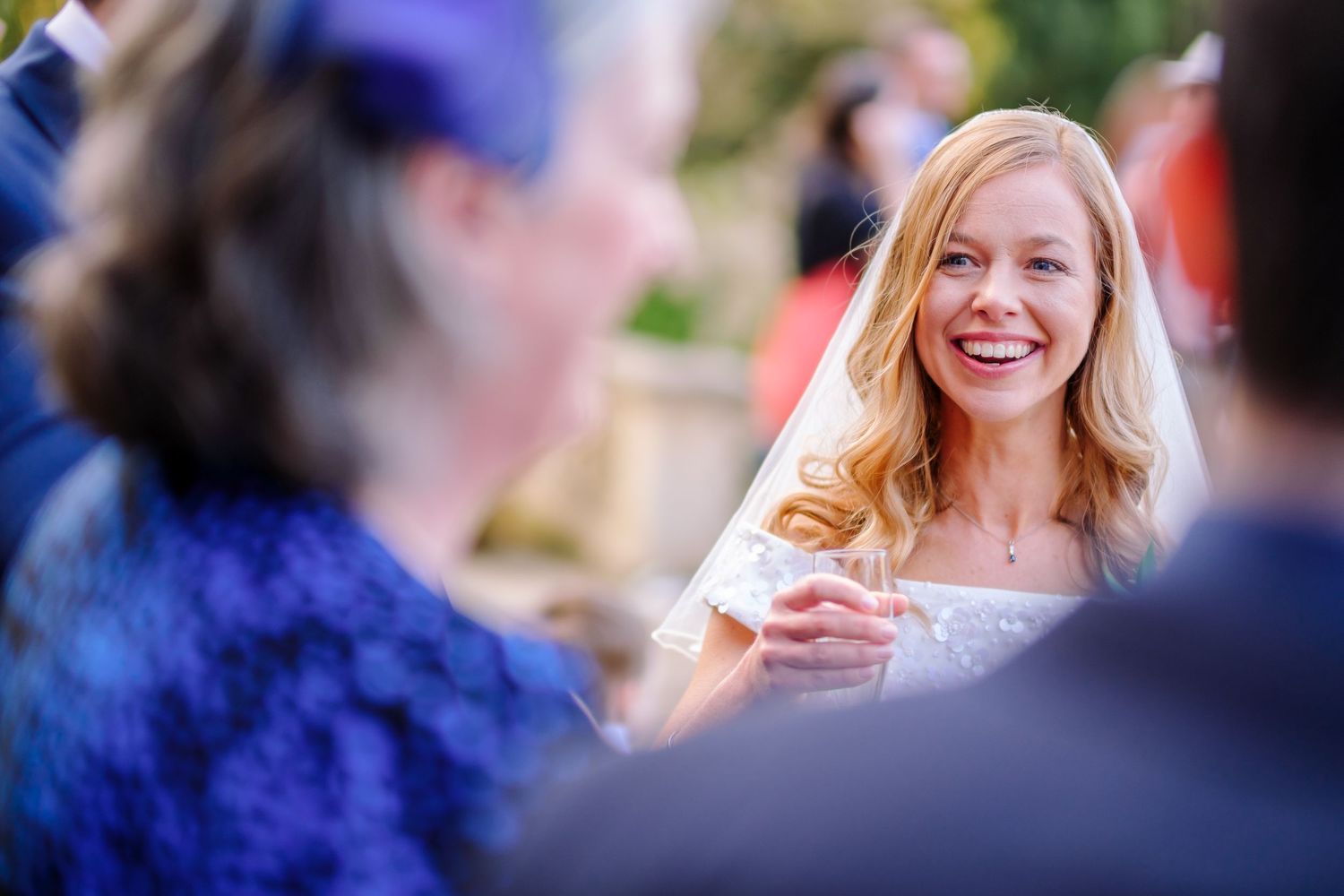 Wedding celebration candid shots showing joyful moments during an outdoor reception.