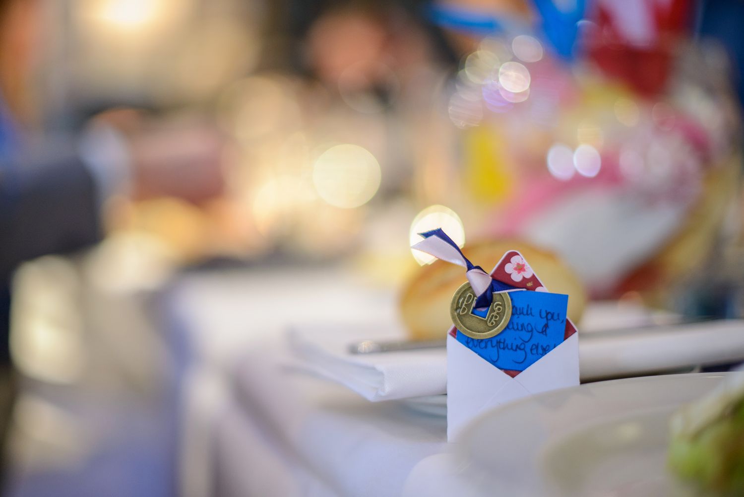 Wedding reception table details with elegant blue and white decor elements.
