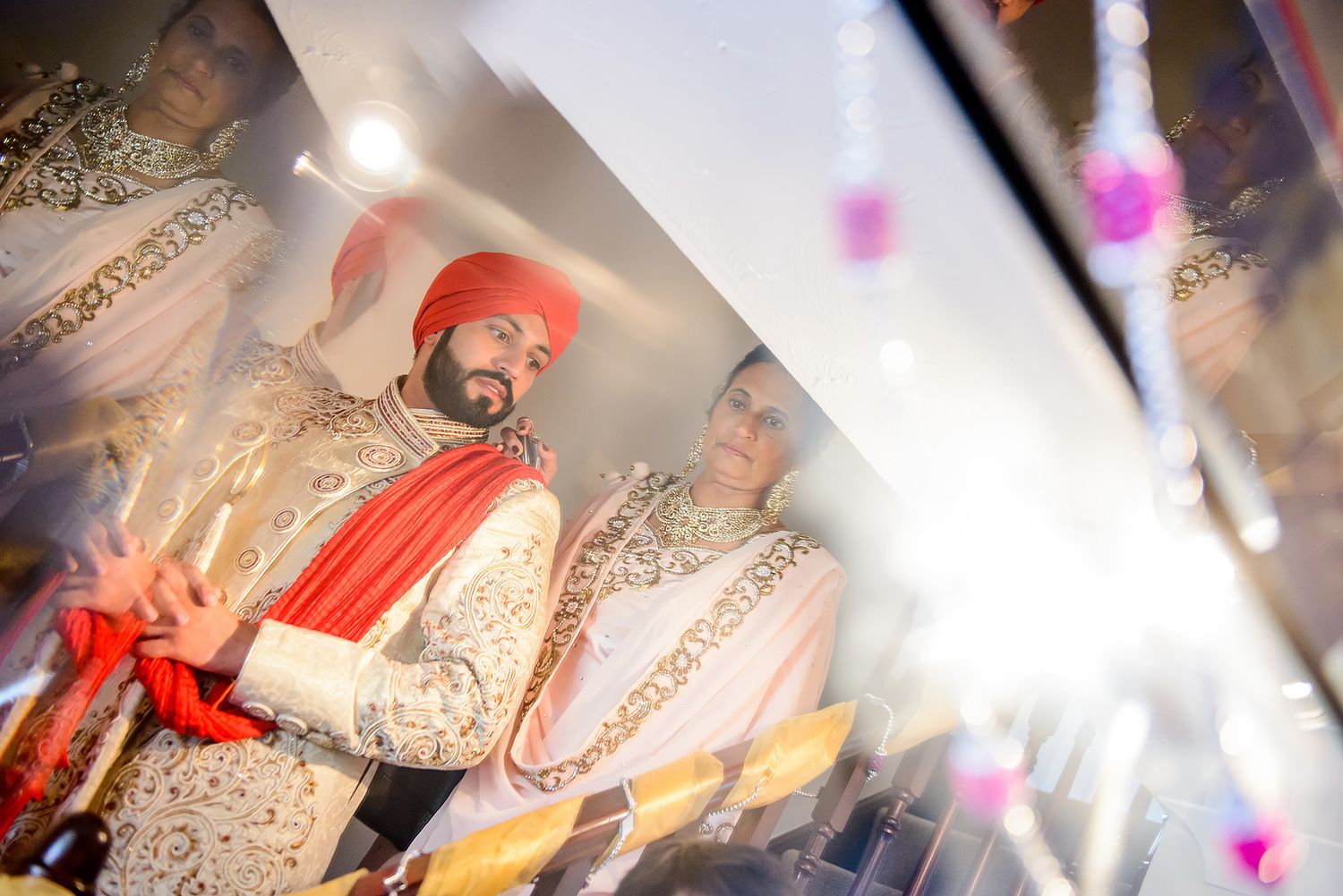 Festive wedding celebration with colorful decorations and traditional outfits.