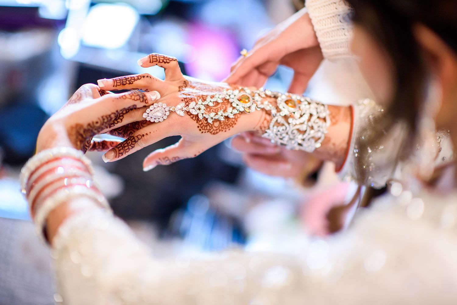 Detailed shot of ornate wedding jewelry and decorative elements with sparkly accents.