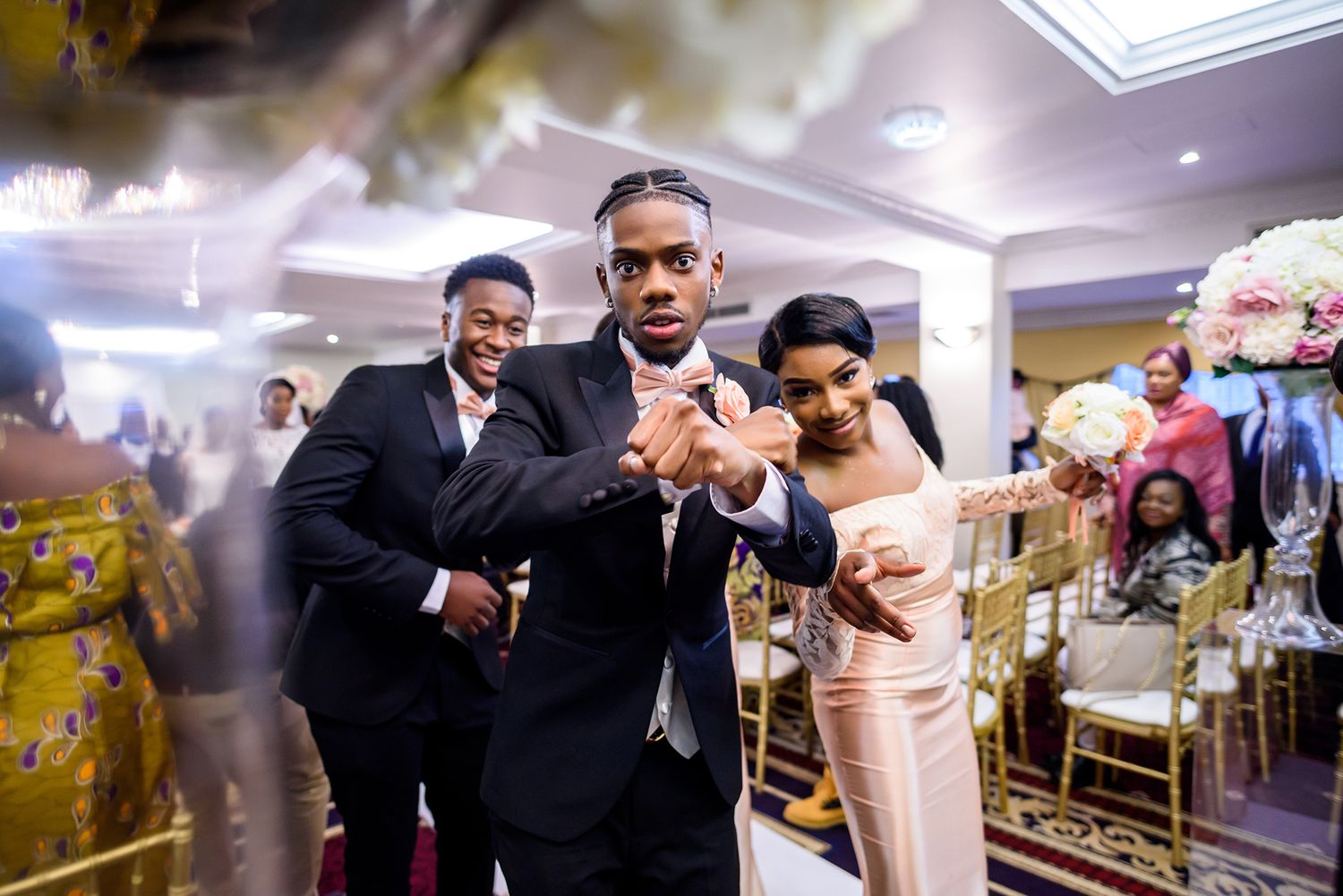 Wedding party dancing and celebrating during reception with joyful energy on the dance floor.