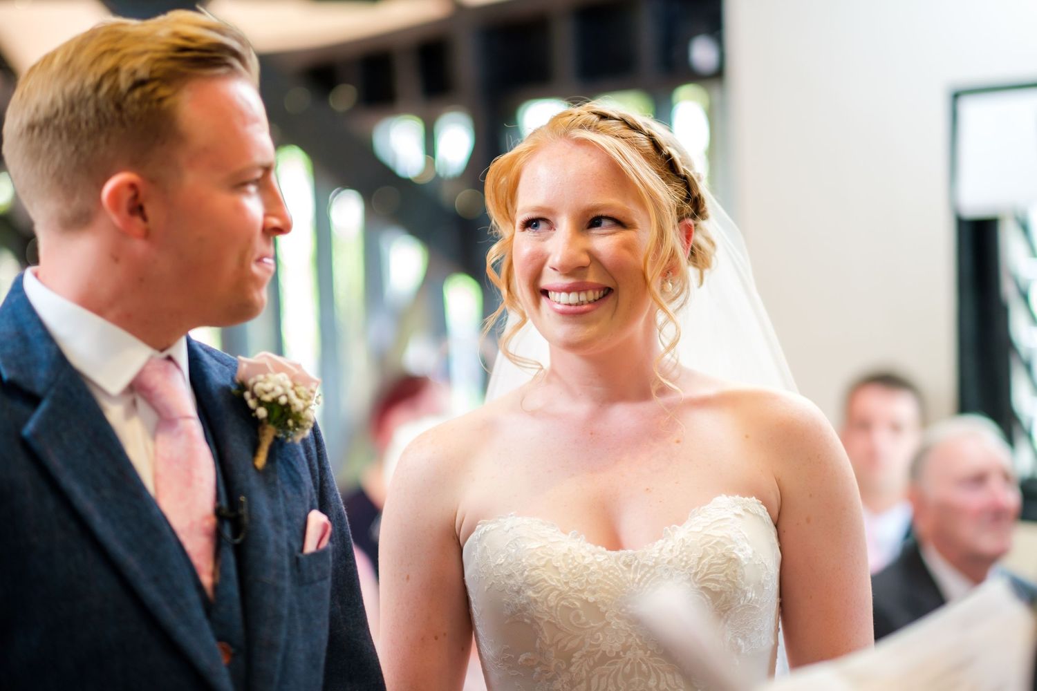 Wedding couple shares a joyful moment during their celebration.