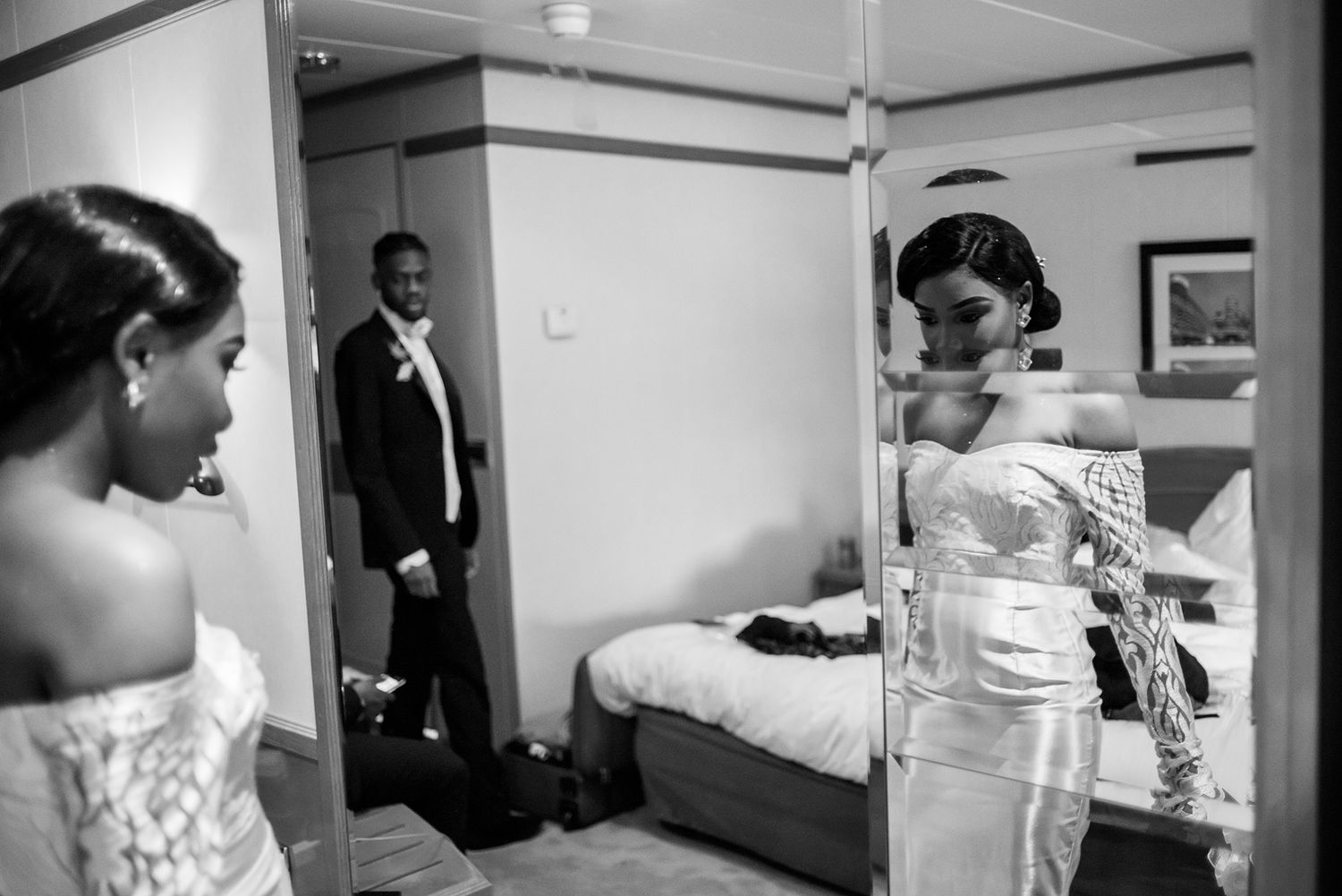 Black and white documentary-style photos capturing pre-event preparations in an interior space.