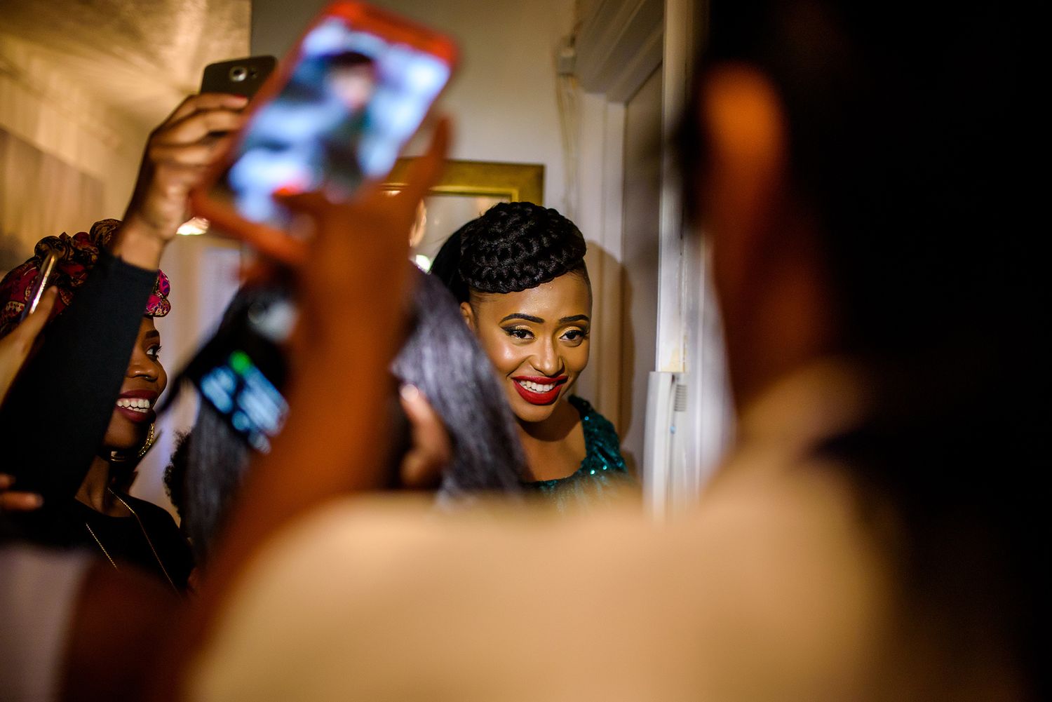Candid shot capturing laughter and celebration at a lively social gathering.
