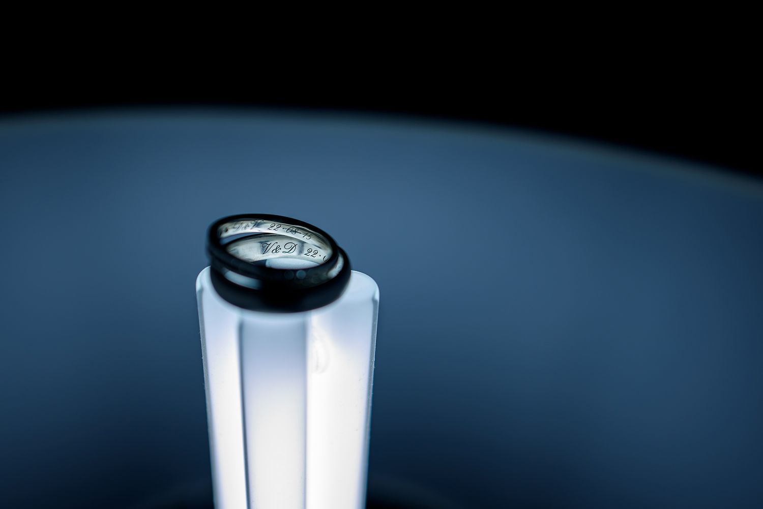 Minimalist blue-toned abstract photograph with dramatic lighting gradient.
