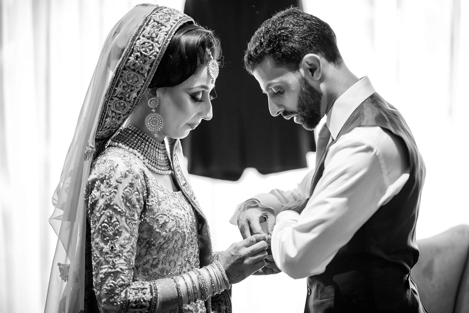 Traditional wedding ceremony preparation with formal attire and decorative details.