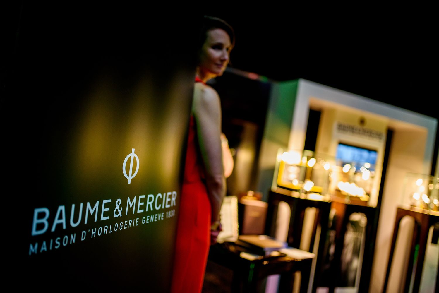 Interior of a modern restaurant or bar with illuminated signage and ambient lighting creating a cozy atmosphere.