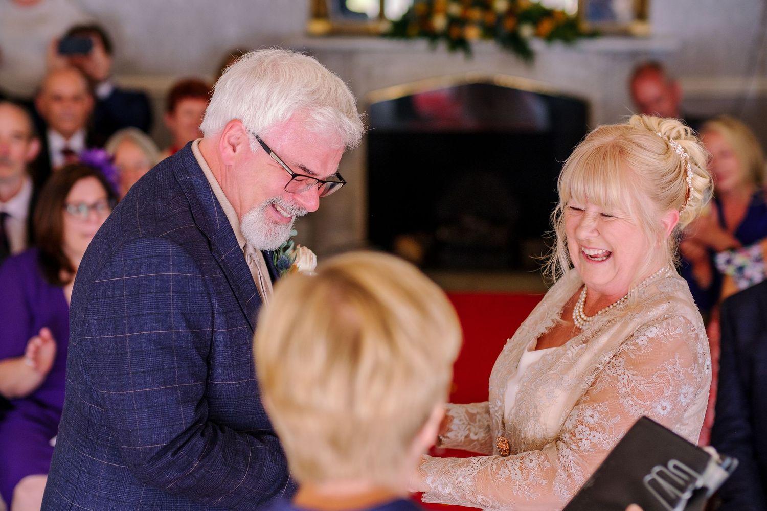 Wedding reception candids showing guests enjoying festivities in an elegant venue.