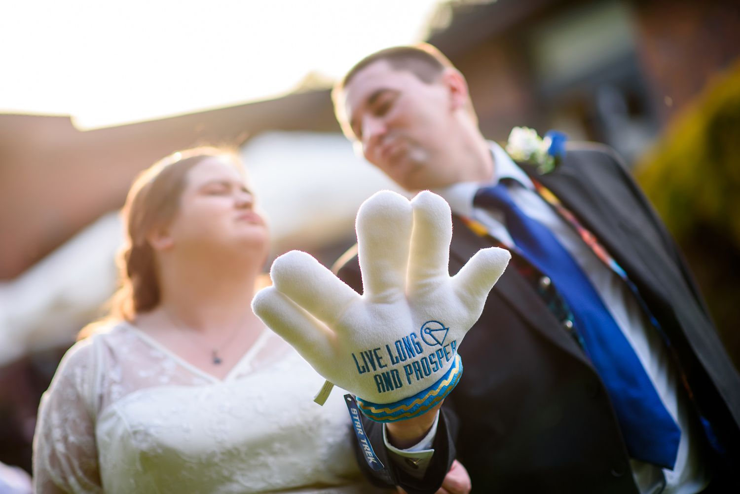Wedding celebration with people in formal attire sharing candid moments.