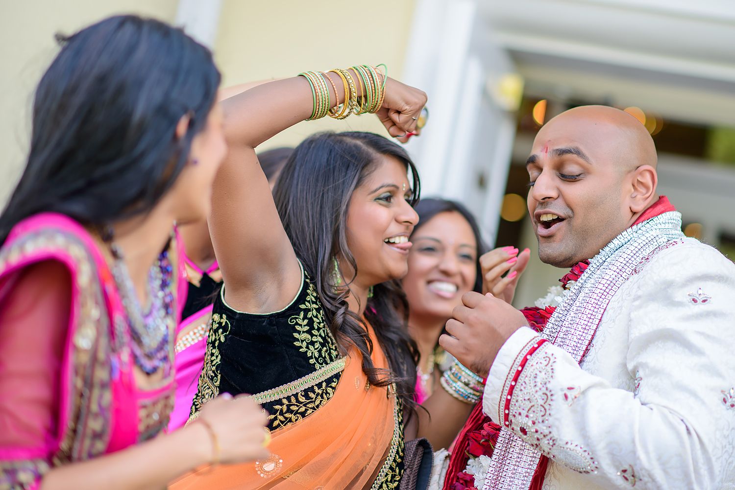 Joyous moments captured during an Indian wedding celebration.