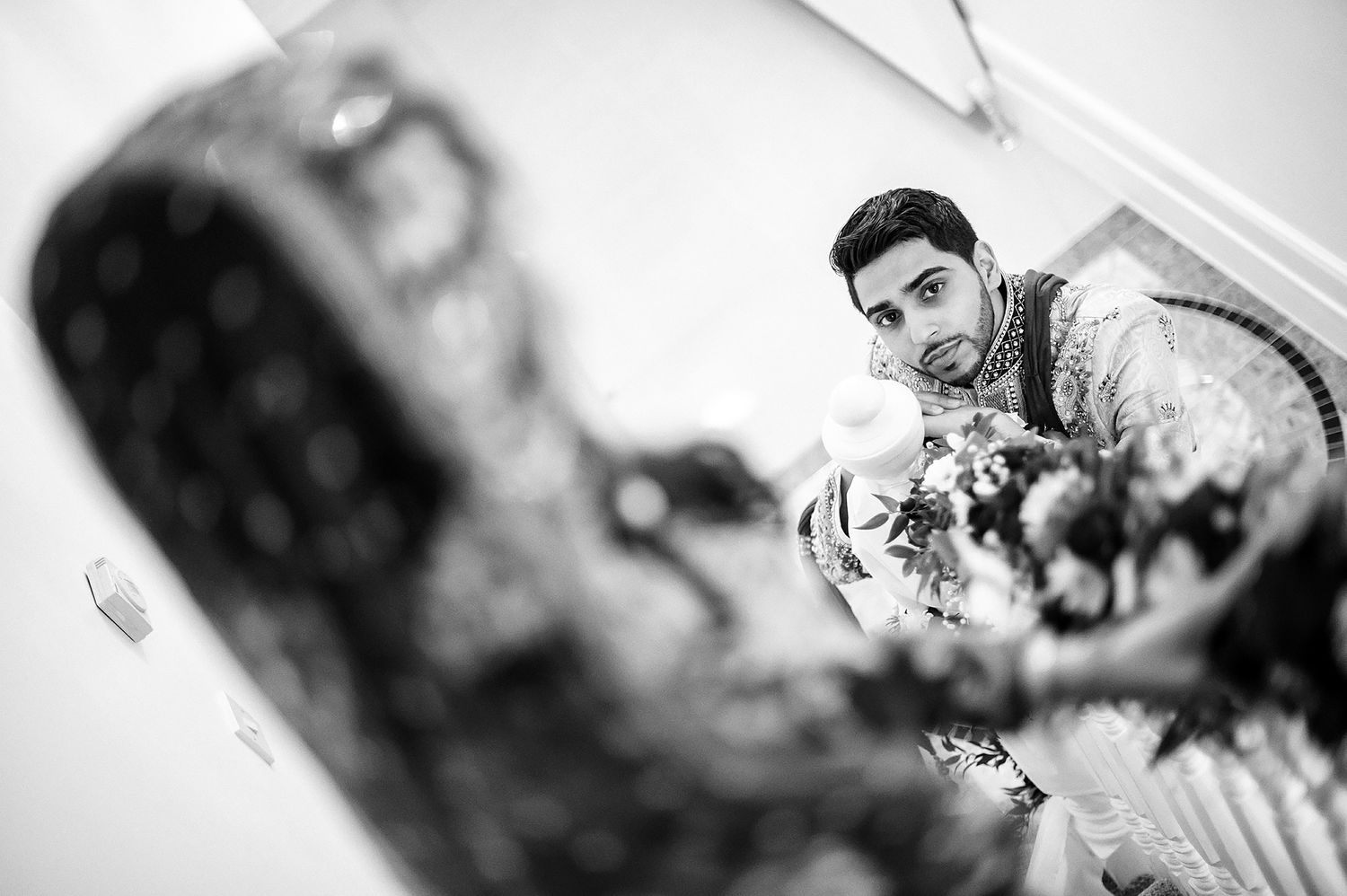 Black and white artistic wedding photography with soft focus effects.