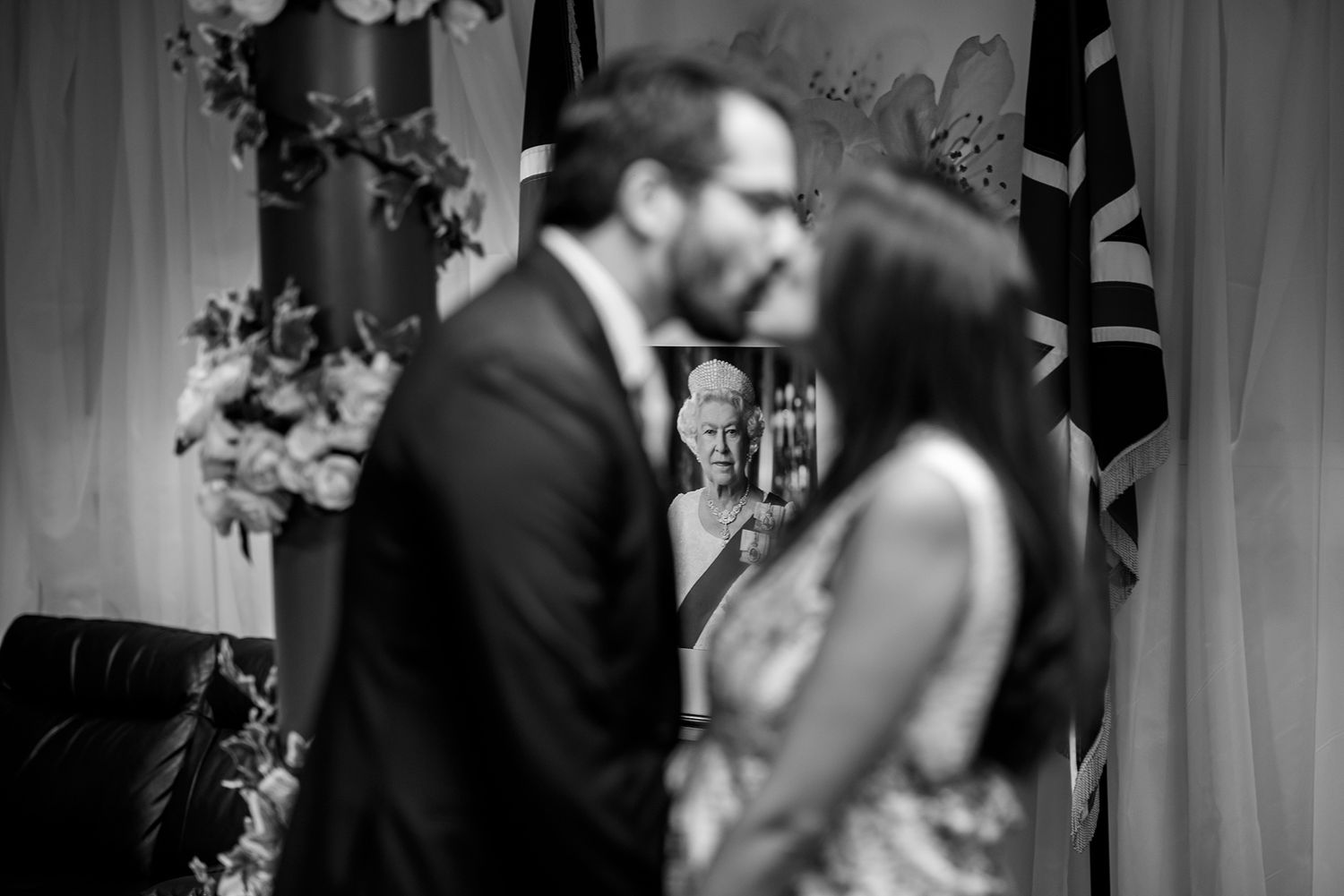 Black and white candid shots showing office meeting interactions.