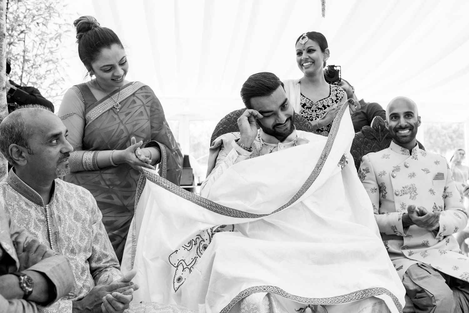 Black and white image of traditional wedding ceremony preparations.