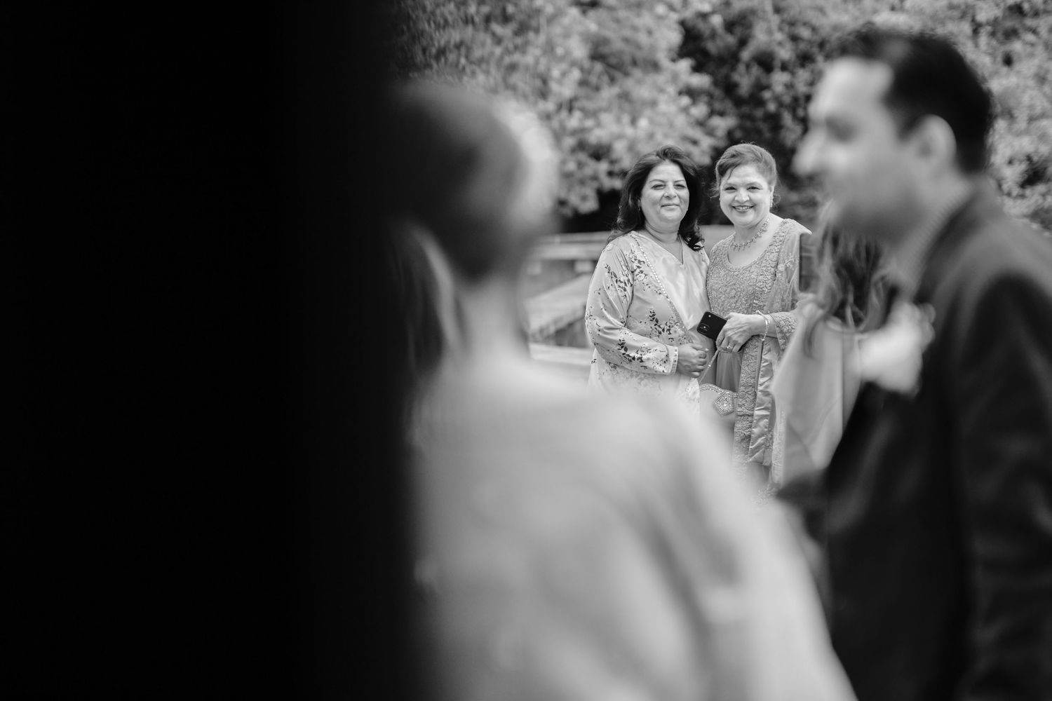 Black and white wedding photo sequence showing intimate moments between a couple during their celebration.
