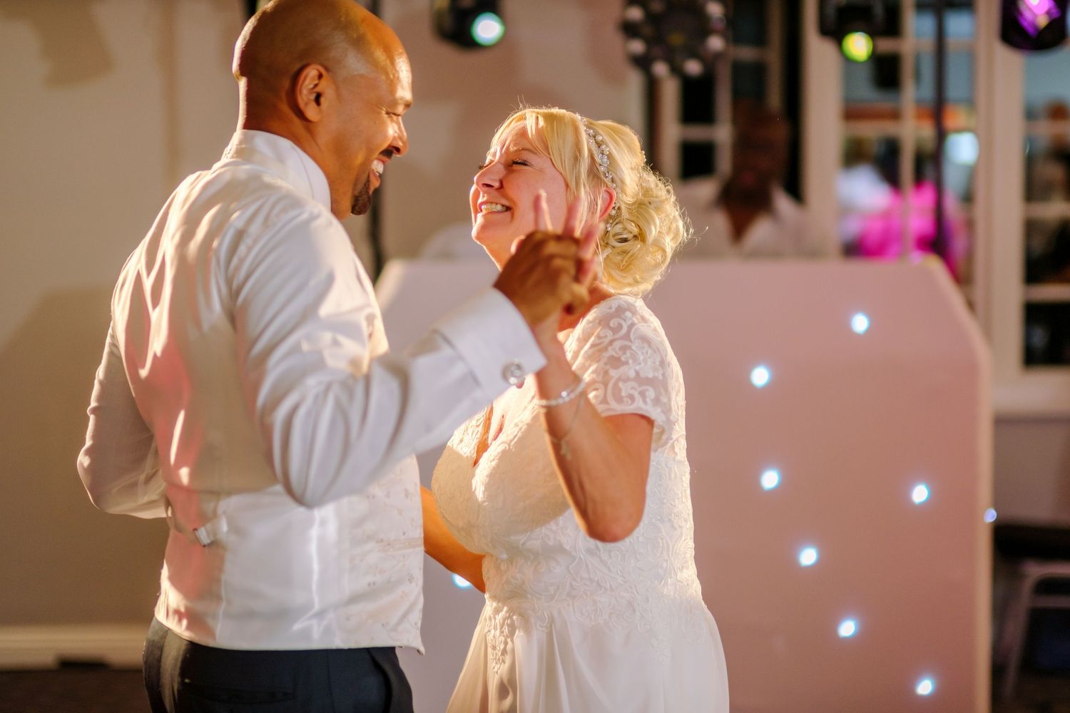 Evening dance celebration with colorful lights and joyful moments on the dance floor.