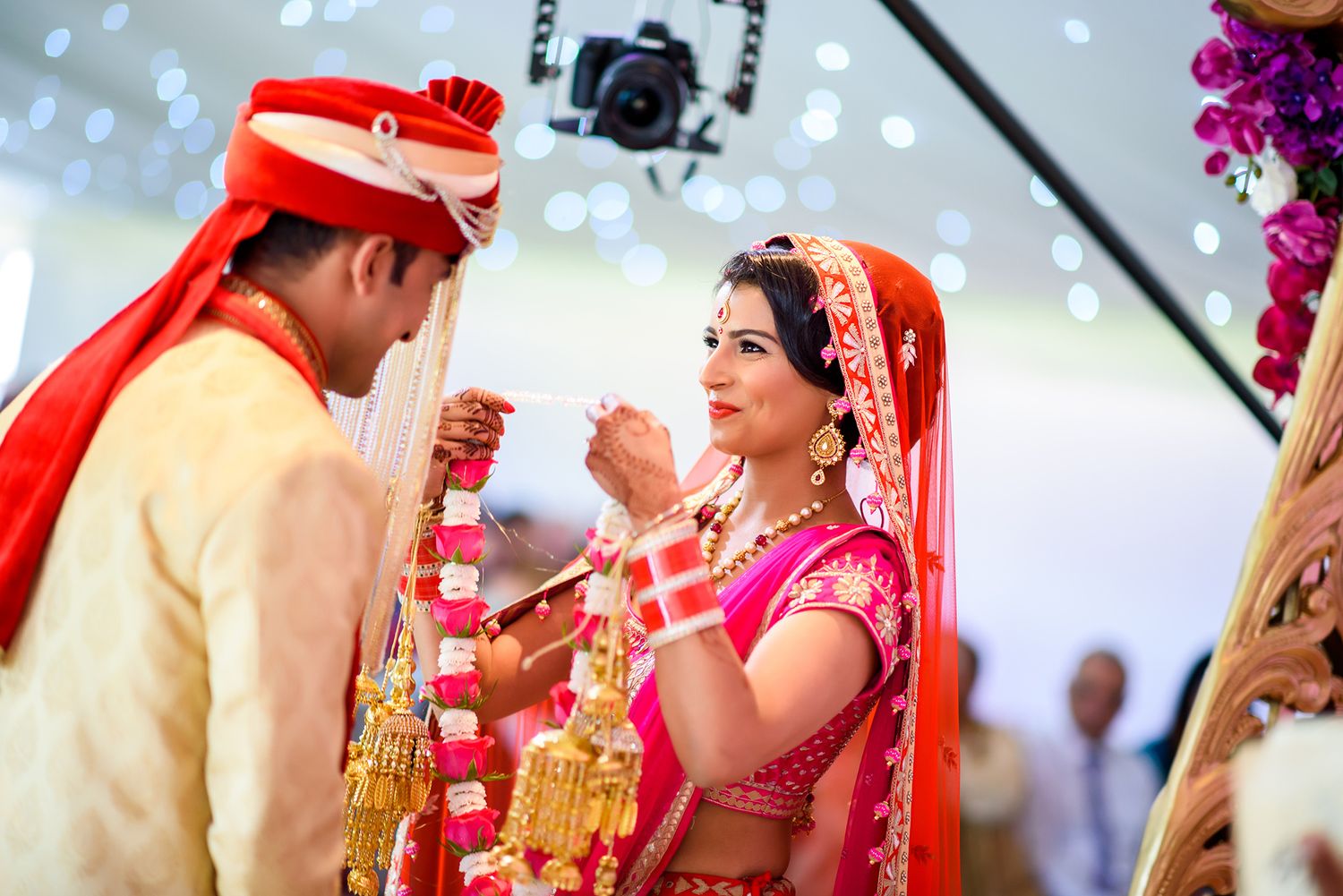Traditional Indian wedding ceremony with couple sharing ritual moment.
