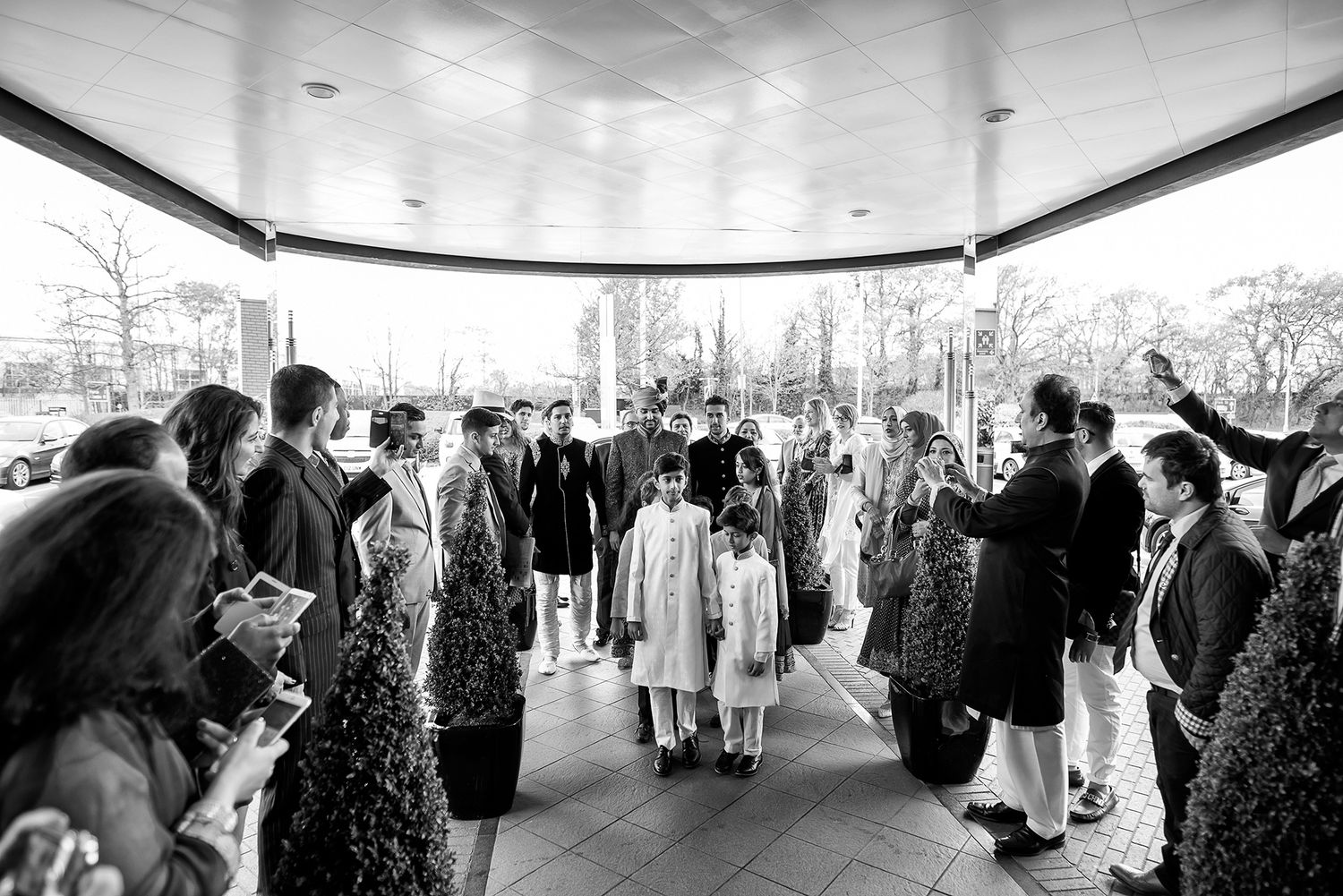 Wide angle view of wedding reception venue with guests mingling.
