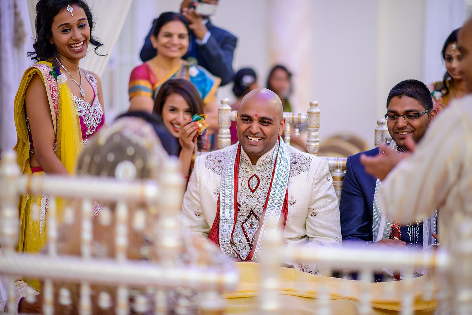 Guests and family members celebrate during a traditional Indian wedding reception.