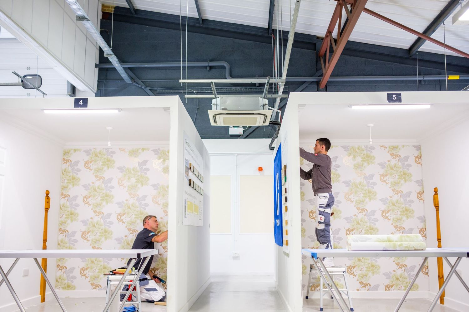 Time-lapse sequence showing the renovation progress of a white room with floral wallpaper.
