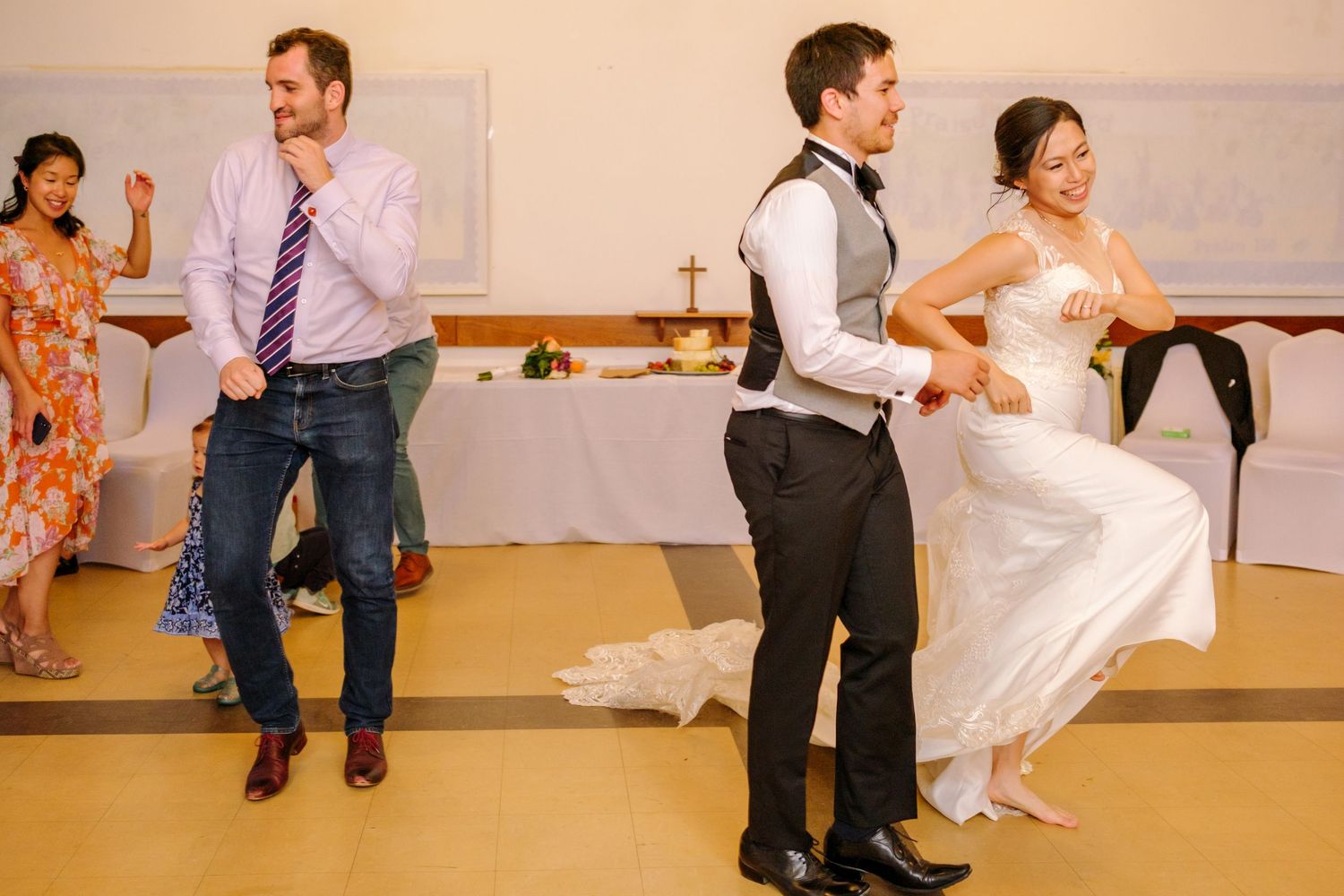Wedding celebration showing couples dancing and enjoying themselves at the reception.