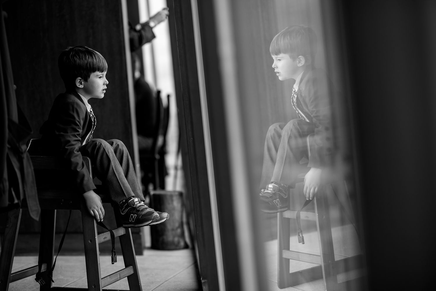 A series of black and white artistic portraits showing intimate expressions in low light.