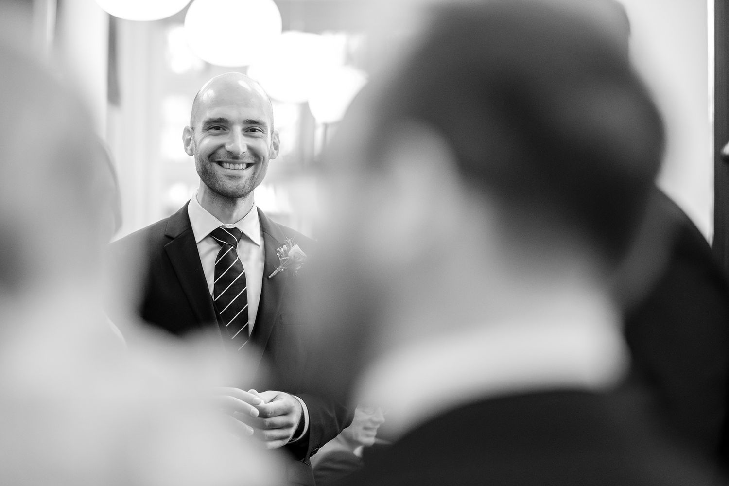 Candid black and white shots of people mingling at social event.