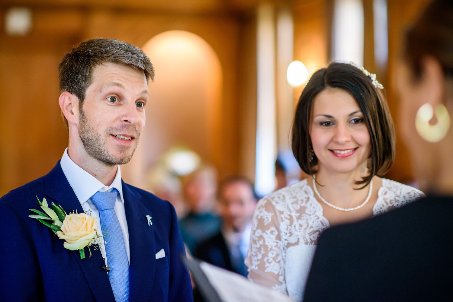 Intimate candid moments captured during indoor wedding reception.