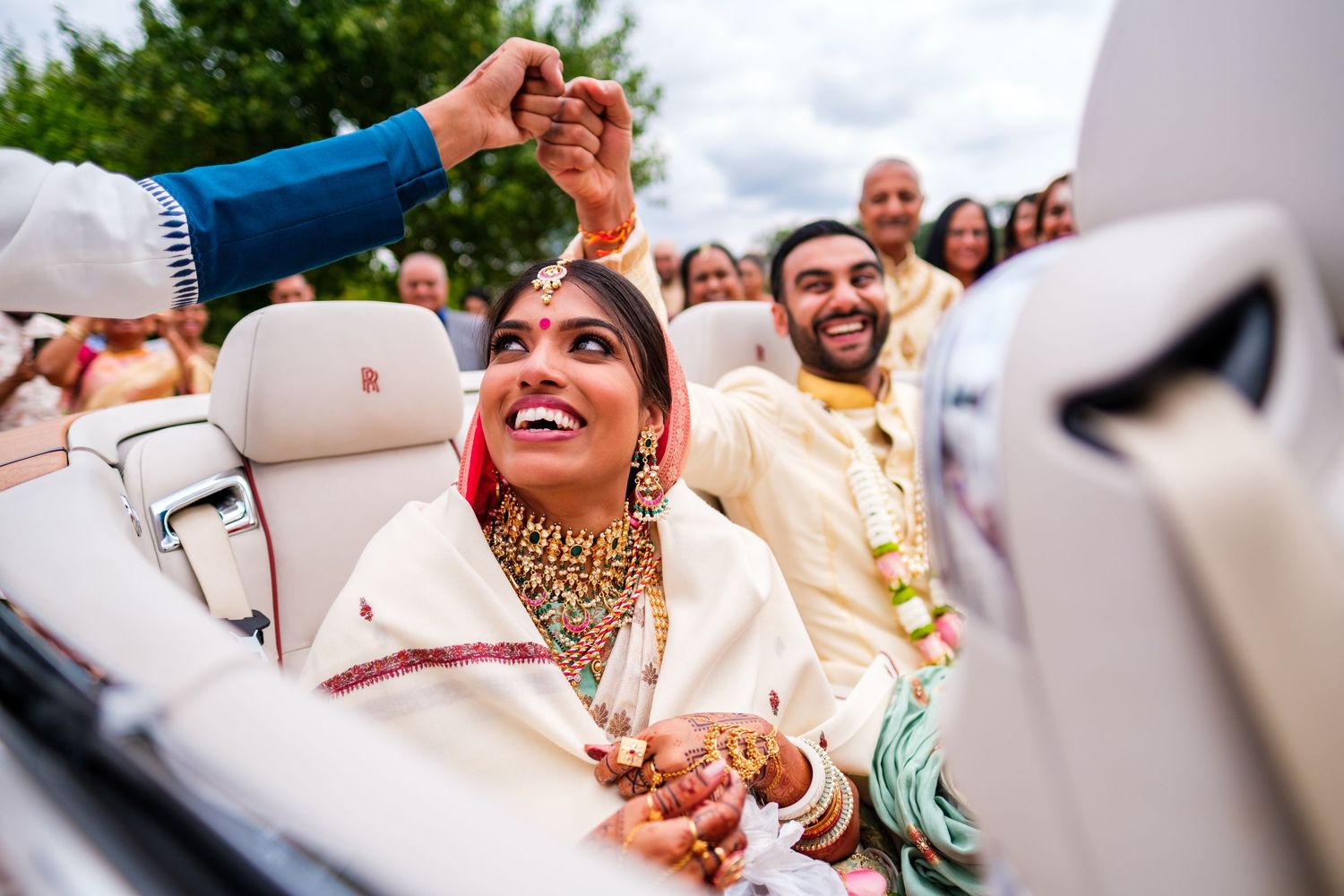 Joyful celebration scenes captured during a traditional Indian wedding ceremony.