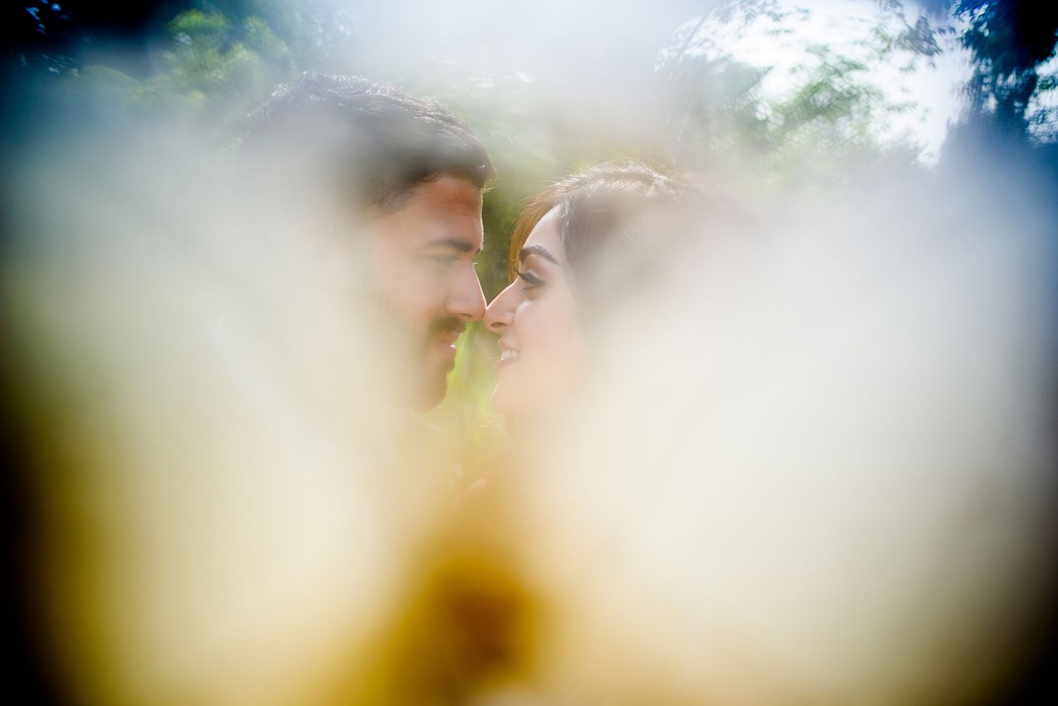 Dreamy wedding photography with soft focus and ethereal lighting effects.