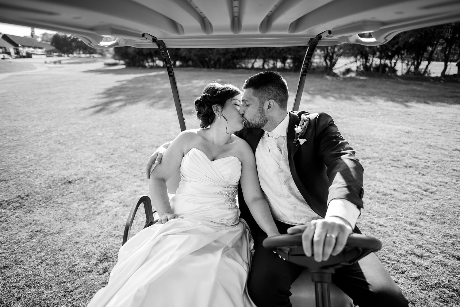 Black and white romantic wedding portraits captured in natural outdoor setting.